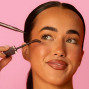 Model applying Lash Therapy Australia brown Everylash mascara and growth serum eyeliner