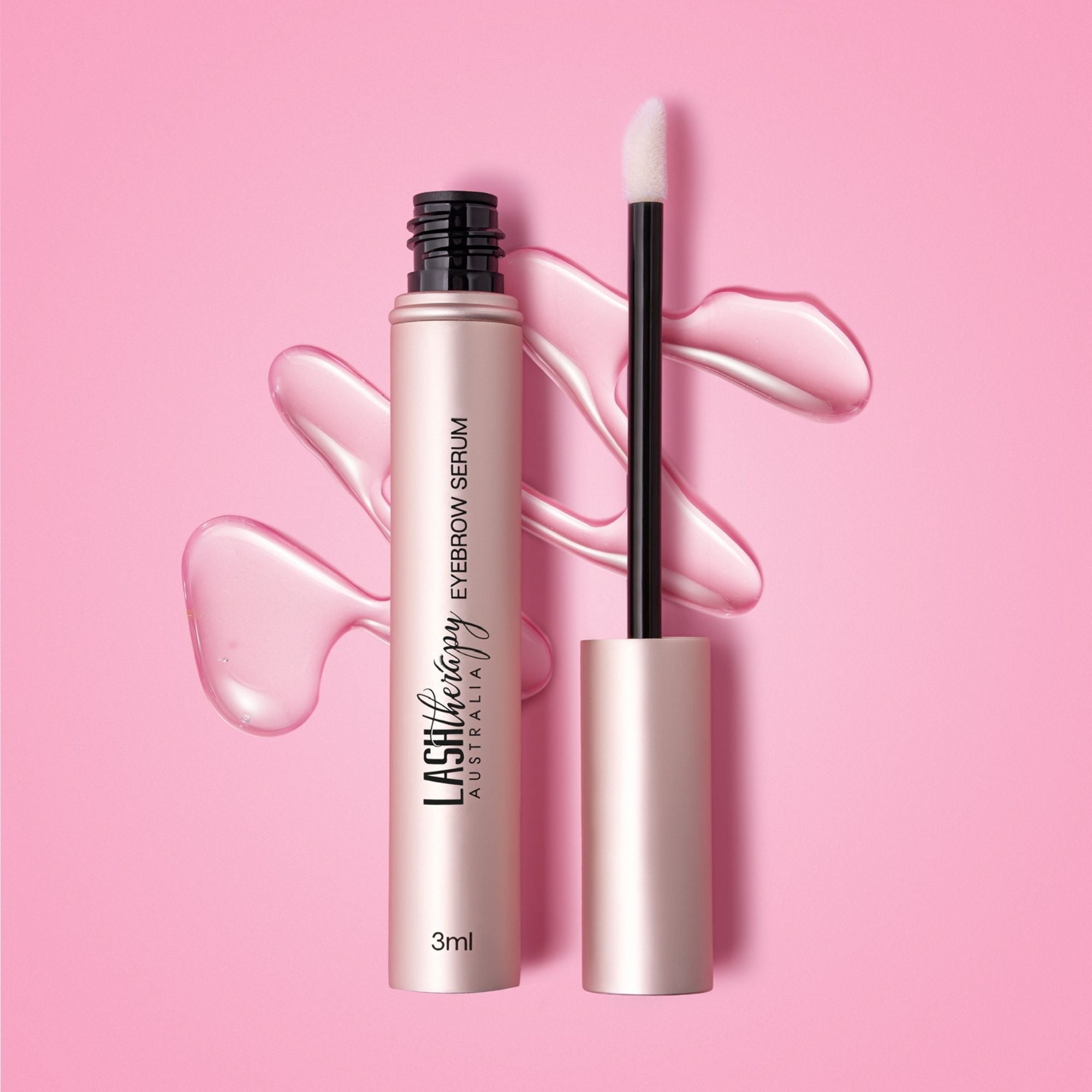 Lash Therapy Australia eyebrow growth serum with peptides with applicator and serum texture on pink background