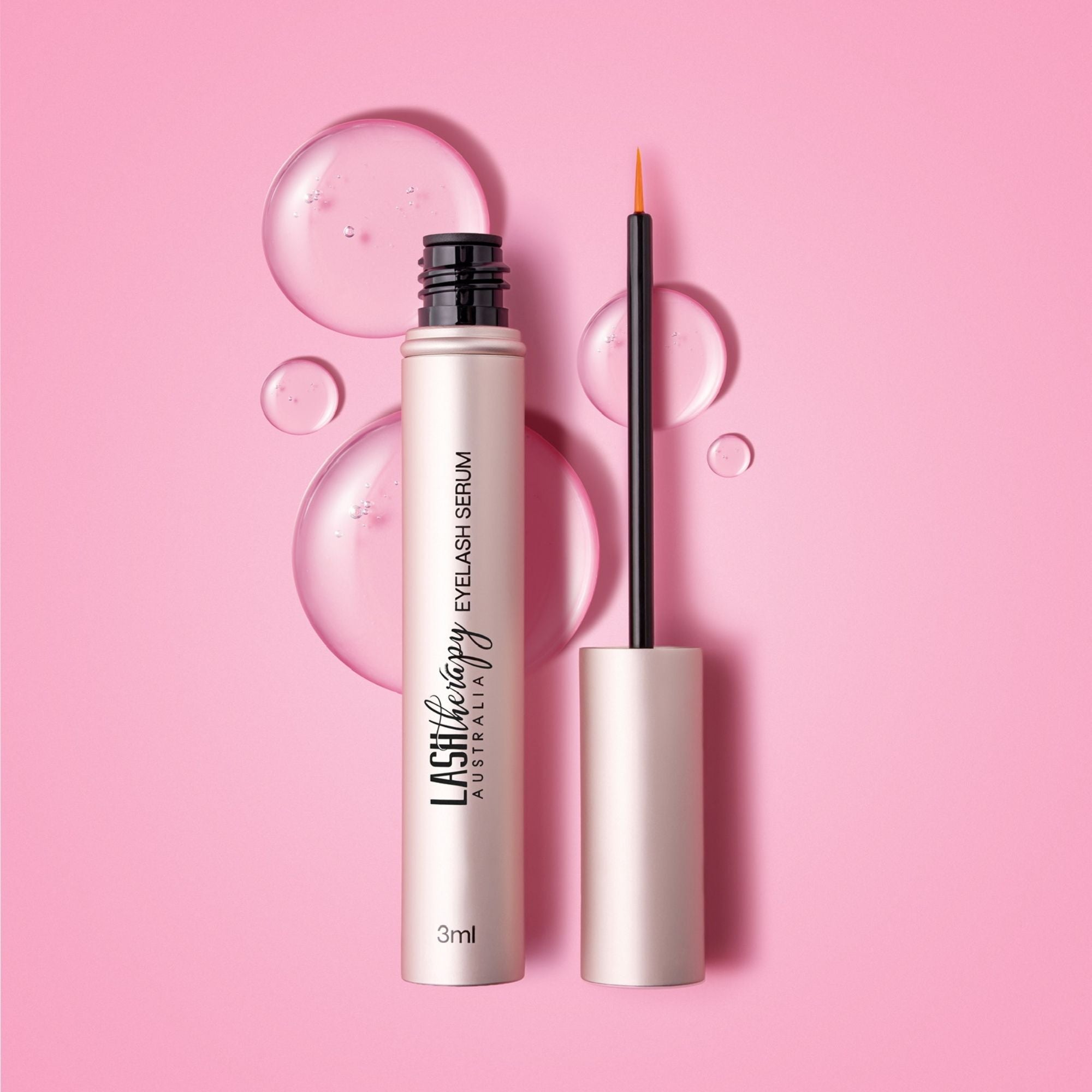 Lash therapy australia lash growth serum with peptides and precision applicator brush on a pink background 
